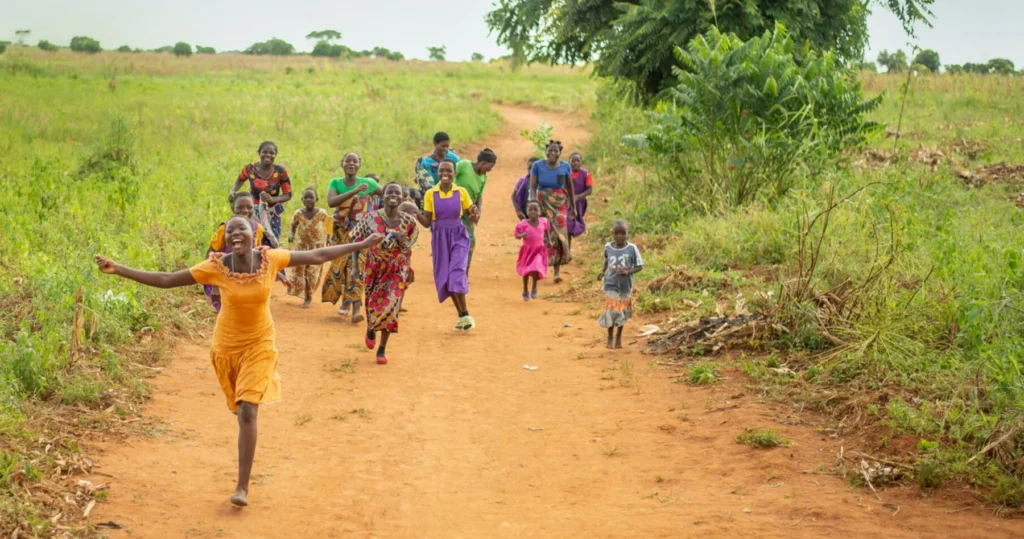 Children walking together along a path in a Design Outreach event photograph